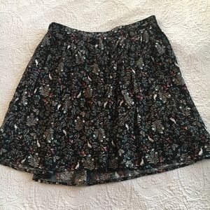Black patterned skirt.